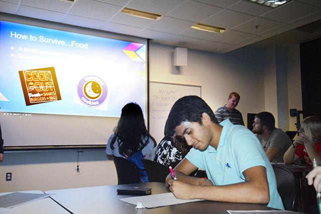 Freshman Kevin Dadhaniya, a member of the Life Sciences First Year Program, takes notes at the Life Sciences First Year college tips workshop. Senior Philip Wirz, junior Rachel Baker, sophomore Jenna Patton, and sophomore Caroline Eberhardt hosted a workshop on Sept. 9 in Fox Labs which they called "Survival Tips," designed for freshman students thinking about majoring in the life sciences. The workshop, one of several that are being sponsored by the Life Sciences First Year program, provided students with a variety of helpful tips ranging from how to navigate Carmichael Gym to how to ace one's first Chemistry exam. Dadhaniya claimed that the most useful tip he heard during the program was to not just default to the library as a study space durng exam time - the crowds make it hard to concentrate, so find somewhere else on campus that is quiet and away from foot traffic.