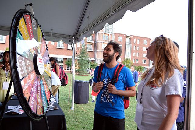 Kunal Verma, a Graduate student studying Computer Science turns the prize wheel at Entrepalooza. Entrepalooza is an annual enrepreneurship and innovation festival hosted by the NC State Entrepreneurship Initiative. The event took place at The Oval Thursday on September 3, 2015.
