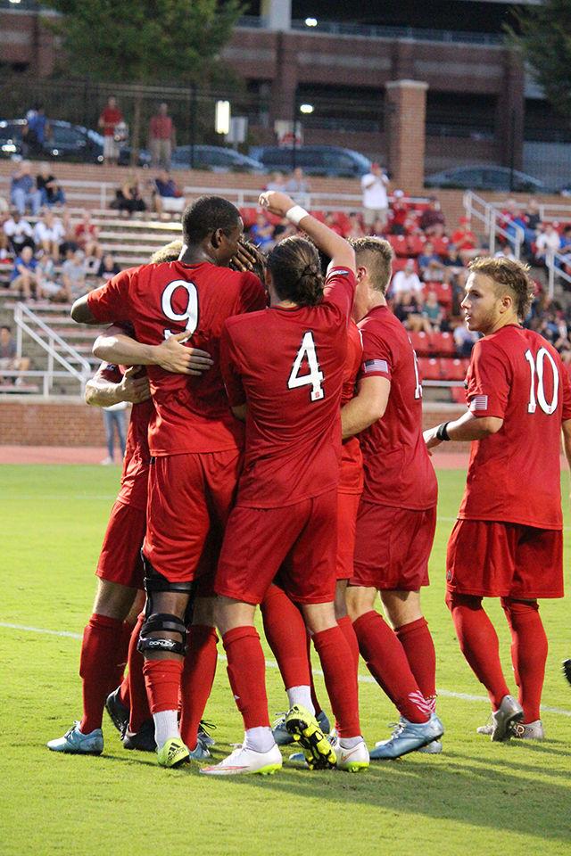 The NC State Men's Soccer team celebrates the first goal of the game against College of Charleston on Monday, Aug 31st at the Dail Soccer Stadium, made by freshman midfielder Julius Duchscherer. Duchscherer attempted 6 shots, 5 of which were on goal. Duchscherer's goal was the first of two, leading the Wolfpack to a 2-0 victory over the Cougars.