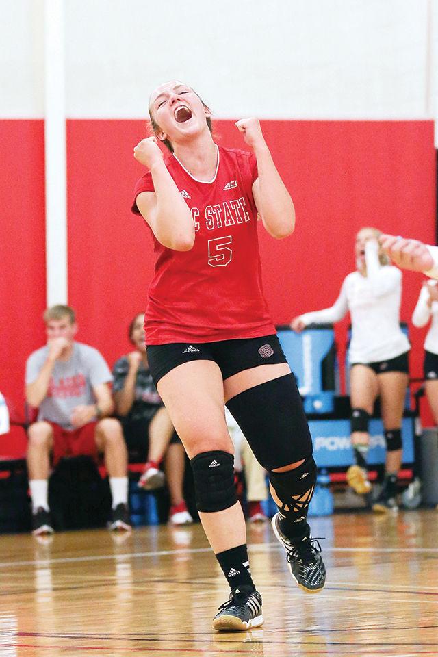 Libero Rachel Eppley celebrates a point against Ole Miss. The Wolfpack lost a 2-3 set heartbreaker marking it as the first loss of the season going 3-1.