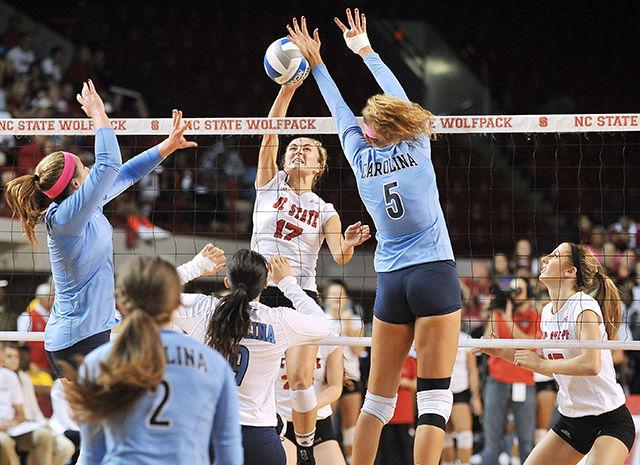 Junior setter Tanna Aljoe spikes the ball against UNC Friday, October 17, 2014. Aljoe had three spikes in the Wolfpack's 3-0 loss to the Tar Heels at Reynolds Coliseum.