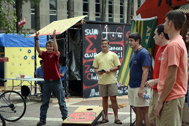 Members of Alpha Gamma Rho play cornhole outside their shack at Shack-A-Thon Sept. 22 on the brickyard. Shack-A-Thon is a yearly tradition at NC State that helps to raise money and awareness for Habitat for Humanity. $18,000 in donations has already been raised, going towards the final goal of $65,000.
