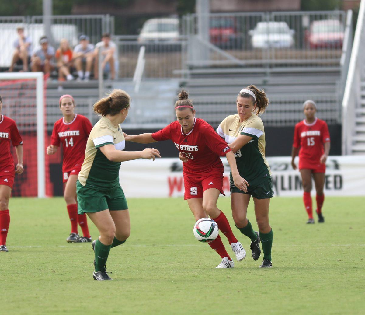 Senior forward Caroline Gentry makes a getaway with the ball against a player from William &amp; Mary. The Wolfpack lost the game 0-3 against the Tribe on September 6 at Dail Stadium, putting them at an overall record of 3-3.