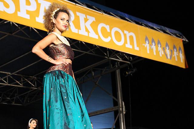 A model shines in the royal dress designed by featured designer Julkee Fashions at Fashion Spark on Saturday, September 19, 2015. Fashion Spark is a part of SparkCon, the annual street art festival of Raleigh.