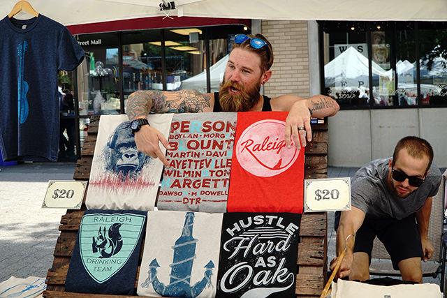 Jay Blevins advertises the wares of Porch Fly, a local apparel company on 9/19. Porch Fly was founded by Joshua Gruder and Bryan Szabo, an NC State Graduate. This was their second year at SPARKcon.The bazzarSPARK section of SPARKcon was reserved for local artisans and vendors.