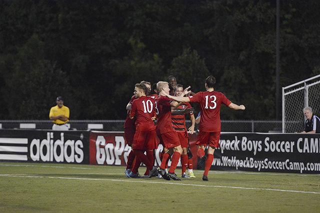 The Wolfpack celebrates a goal by freshman midfielder Julius Duchscherer during the first half of the game against the College of Charleston. This was the Pack's first regular season home game of the school year played on Aug. 31 at Dail Soccer Stadium.