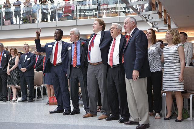 Khari Cyrus, Thomas Stafford, Carter Long, Chancellor Randy Woodson, and James Woodward join together to sign NC States Alma Mater. The Marching Band wrapped up Talley Student Union's Grand Opening on Sept. 9th