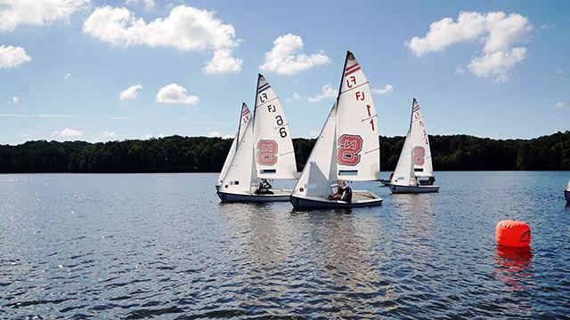 The boats make a turn around a buoy during the Sailing Club's first womens regatta at Lake Wheeler on 9/19.