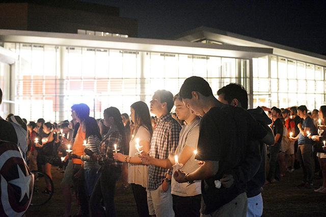 UNC students Mitchell Casey, Catherine Bellew, Piper Davis, Brian Rock, Matthew Fedder and friends gather for the candlelit vigil in honor of Joseph Alexander Banks on Stafford Commons on Tuesday night. They knew Banks from high school and wanted to pay their respects.
