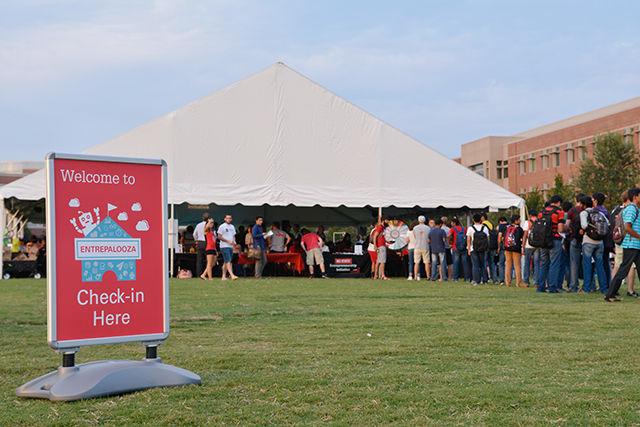Students wait in line for the Proze Wheel at Entrepalooza. Entrepalooza is an annual enrepreneurship and innovation festival hosted by the NC State Entrepreneurship Initiative. The event took place at The Oval Thursday on September 3, 2015.