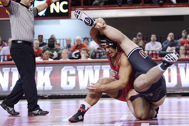 No. 1 redshirt junior Nick Gwiazdowski battles for the takedown against No. 6 Oklahoma State University. Although Gwiazdowski won this match 4-1, the Wolfpack lost a tough battle with a final score of 12-20 in Reynolds Collisuem on Feb. 22.&#160;