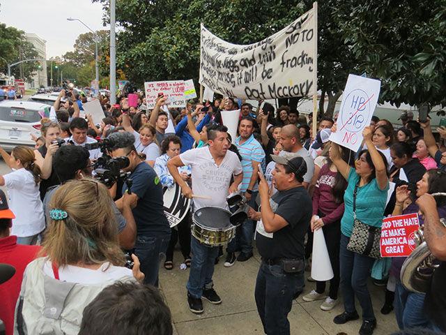 A band performs Latin music as protesters dance in front of the Governor's Mansion on Thursday.&#160;