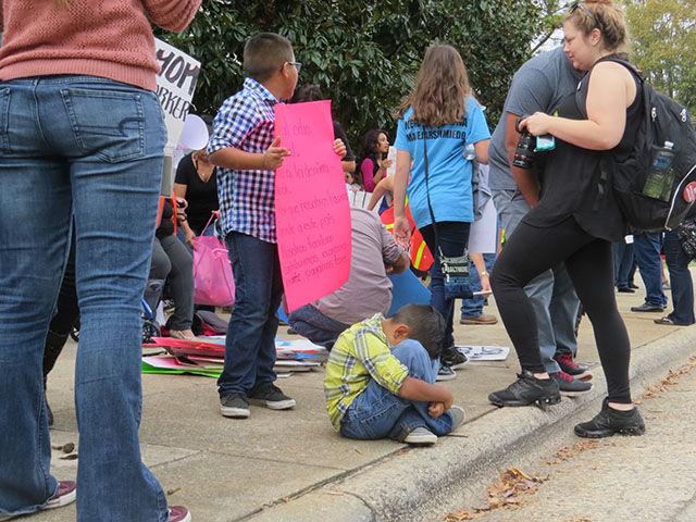 A young Hispanic boy cries in the midst of the crowd of protestors against HB 318 in front of the Governor&#8217;s Mansion on Thursday.&#160;