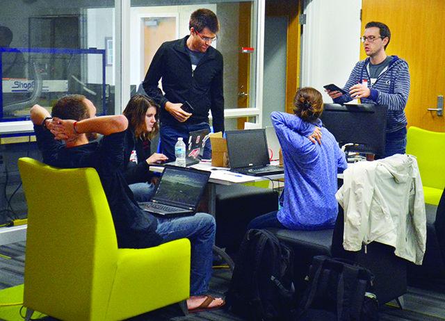 Micheal McKnight, a Ph.d student studying electrical engineering, talks to his team about their idea at RIoT Hackathon. The Raliegh branch of IoT (Internet of Things) hosted the event to help young entrepeuners join the movement. The event was held in the Analytical Instrumentation Facility on Centennial Campus from Friday to Sunday.