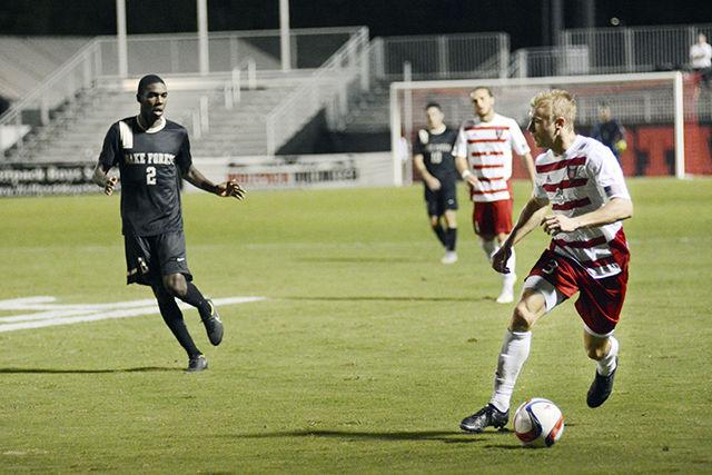 Caleb Duvernay, a sophomore and defender for the Wolfpack soccer team, rushes down the field at the game versus Wake Forest on Oct. 9 on the Dail Soccer Field. Zach Knudson was in play for 110 minutes and had one shot on goal. The Wolfpack tied No.4 Wake Forest, 0-0.