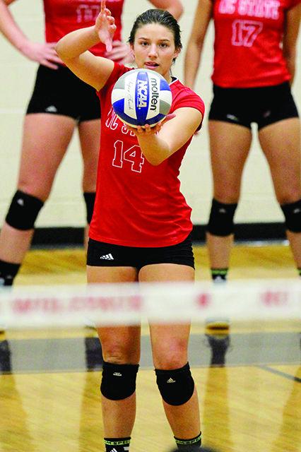 Blayke Hranicka readies a serve during match play at Broughton High School. The NCSU Women's Volleyball Team played the University of Virginia at Holliday Gymnasium on September 10. The Woflpack lost the match 3-0.