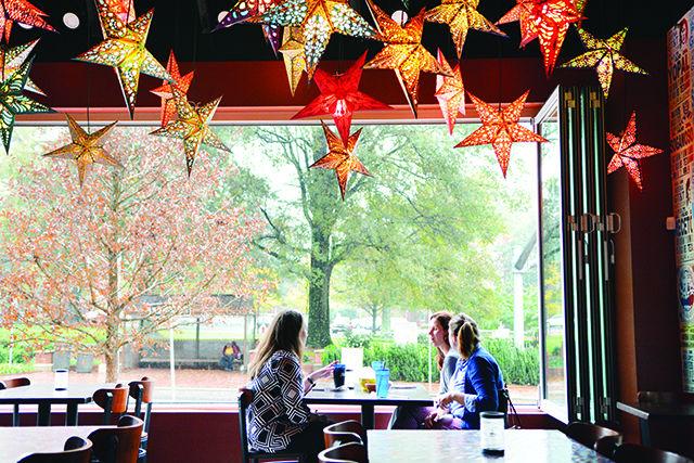 Stephanie Money and Sara Chriscoe, Associate Directors of University Special Events, and Nicole Willets, Events Specialist, enjoy their first meal at Gonza Taco Y Tequila's new Hillsborough location at the grand opening Wednesday. Gonza's fourth location is located inside the new Aloft Raleigh hotel, and will offer lunch, dinner and Sunday brunch, as well as extended late night hours and a bar menu.