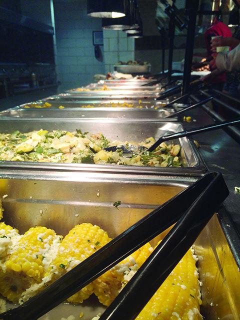 Roasted corn cobbettes with chile-lime butter and cotija cheese along with a couple of more dishes native to Latin America were a part of University Dining's themed dinners. This event took place in Fountain Dining Hall on Oct 15, 2015.