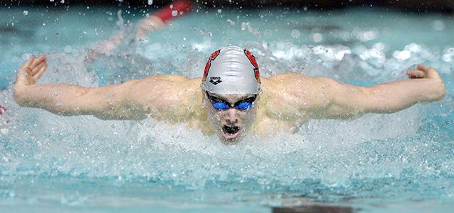 Junior Jason Deana plows down the lane while competing in the 100-yard butterfly during NC State's meet with rival UNC-Chapel Hill Jan. 31 at the Casey Aquatic Center. Deana placed third in the event with a time of 48.58. The No. 8 Wolfpack men's team remained undefeated, beating the No. 20 Tar Heels 180-118. The No. 12 women's team just barely missed topping the No.5 Tar Heel women 146.5-134.5.