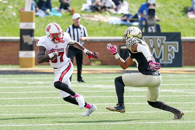 Redshirt freshman wide receiver Maurice Trowell jukes out a Wake Forest defensive back to get a first down. Trowell had four receptions for 87 yards and a touchdown, the first in his career. The Wolfpack came back from a bye week to win 35-17 on October 24th in BB&amp;T field at Wake Forest.