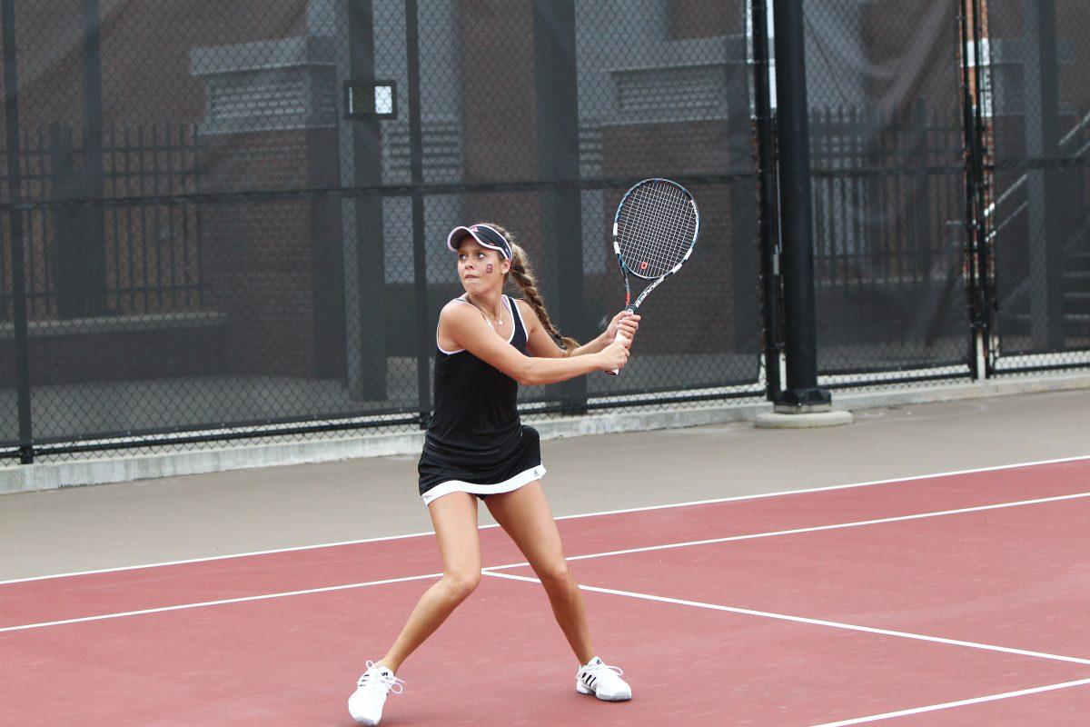 Freshman Amanda Rebol competes in singles play during her collegiate debut.