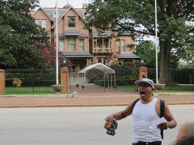 Octabeo Flores leads the protest in a chant in front of the Governor&#8217;s Mansion on Thursday.