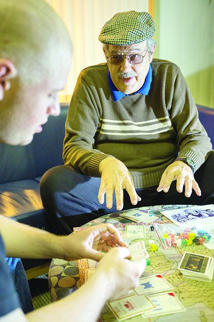 Lew Pulsipher explains the rules of one of the board games that he designed, Sea Kings, to AJ Carlson, a senior studying mechanical engineering, during the Table Top Gaming Club meeting on Friday. Lew has a book called &#8220;Game Design: How to Create Video and Tabletop Games, Start to Finish,&#8221; which was published in 2012 by McFarland. Pulsipher has attended the Table Top Gaming Club for over eight years and has seen the club grow from a dozen to as many as 84 attendees. The club meets on most Fridays in Witherspoon from 6-11 p.m.