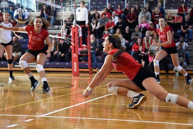 Freshman Defesnsive Specialist, Makenzie Kuchmaner, digs for the ball against Florida State University on October 18th at Broughton Highschool. The Seminoles defeated the Wolfpack 4-1 with a fourth set score of 25-20. Kuchmaner had Nine digs against Florida State University.