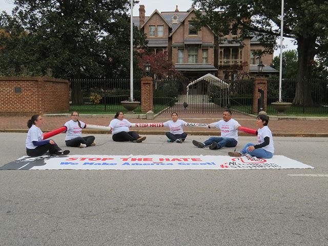 Angeline Echevarria, Ivana Gonzalez, Carmen Rodriguez, Iliana Salazar, David Salazar and Nayely Perez chained themselves together in front of the Governor&#8217;s Mansion in downtown Raleigh on Thursday in protest of Governor Pat McCrory&#8217;s signing of HB 318. &#8220;Listen McCrory, we are in the fight!&#8221; they chanted with the crowd.