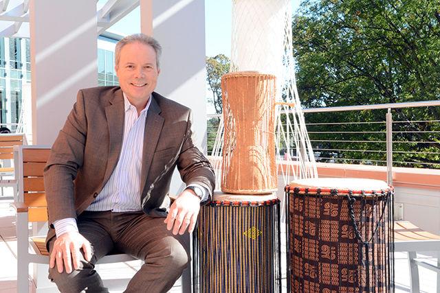 Richard Holly, the new executive director of ARTS NC STATE, poses with only a few of the several drums he keeps in his office in Talley Student Union. Holly joined the Wolfpack in July after serving as the Dean of the College of Visual and Performing Arts at Northern Illinois University. He has been playing the drums for about 50 years with performances at schools, colleges, conventions and festivals throughout the world. Holly will be performing at Stewart Theatre later this year.&#160;