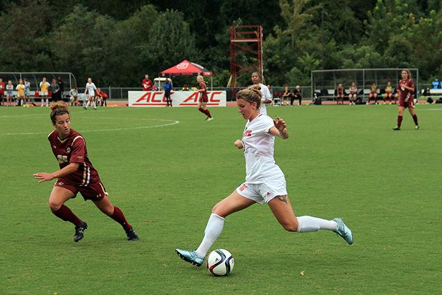 Senior midfielder Jenna Kalwa, 3, dribbles the ball down the sideline.