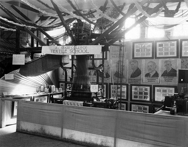 This photo is from the beginning of the 1930s, when North Carolina State University was named North Carolina State College. In this photo, the North Carolina State College of Textile School showcased their textiles exhibit at the State Fair.&#160;