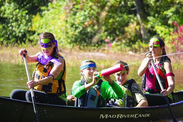 Competitors don costumes to compete in the second Monster Dash on Centennial Campus by running, canoeing and crawling their way to the finish line with pumpkin in tow.