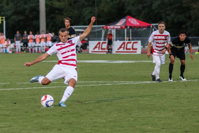 Freshman midfielder Julius Duchscherer takes and scores a penalty kick against Wofford goalkeeper Garrett Closs. No. 20 NC State took down Wofford 2-1 in Dail Soccer Stadium on Tuesday.