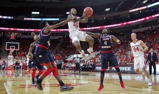 Anthony "Cat" Barber, junior guard drives the lane during the men's basketball game at PNC Arena. The wolfpack played the University of South Alabama Sunday, November 15. Barber had 17 points and 12 rebounds. The Wolfpack won the game 88-70.