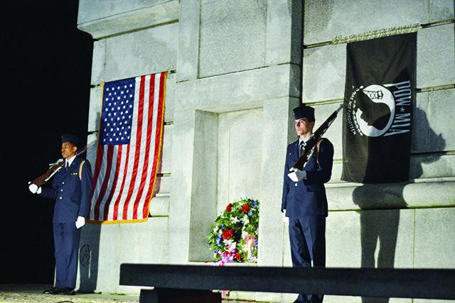 Tyrique Harris, a sophomore studying microbiology, and Steven Furman, a sophomore studying biological sciences, participate in the Veteran's Day Vigil for their first time at the Bell Tower, Tuesday, Nov 10, 2015.&#160; As members of NC State's ROTC Air Force program they stood post at the candle vigil for one hour in remembrance for those that have passed and those that are still fighting.