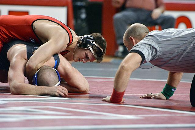 Sophomore Pete Renda holds down Duke's Trey Adamson during the 174 lb. weight class bout Wednesday evening, Jan. 7, 2014 in Reynolds Coliseum. Renda defeated Adamson by decision 6-5. The Wolfpack narrowly lost the the Blue Devils 18-17 after No. 17 Sam Speno (141 lb.) was downed by decision by Duke's Evan Botwin 6-4.