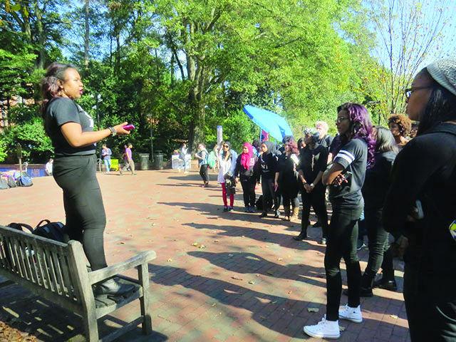 Jasmine Cannon, a senior majoring in women&#8217;s and gender studies, addresses a group of her peers in Wolf Plaza on Thursday. &#8220;[We are] standing in solidarity with those who have been facing overt discrimination whether it be violent or mental or any sort of discrimination and haven&#8217;t been able to garner the support that they need from administration,&#8221; Cannon said.