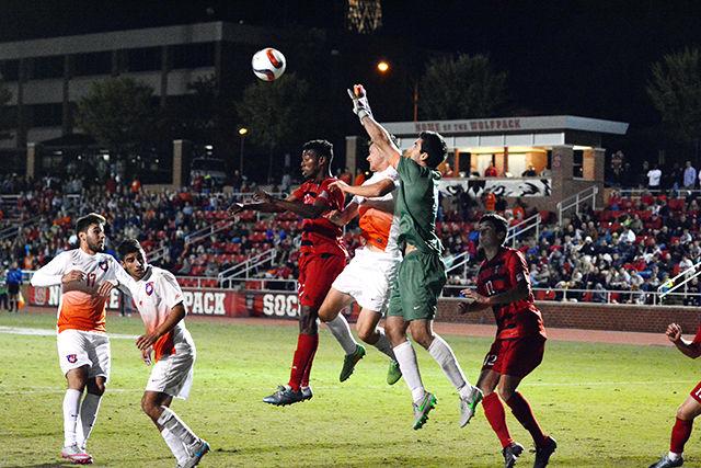 Red shirt midfielder Philip Carmon attempts to head the ball into the goal. Carmon took four shots and made one during NC State soccer's senior night game. NC State mens soccer lost 1-4 to Clemson on October 30th at Dail Soccer Stadium.