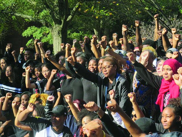 Students gather in Wolf Plaza to show support for students at the University of Missouri and across the country fighting against racial discrimination.