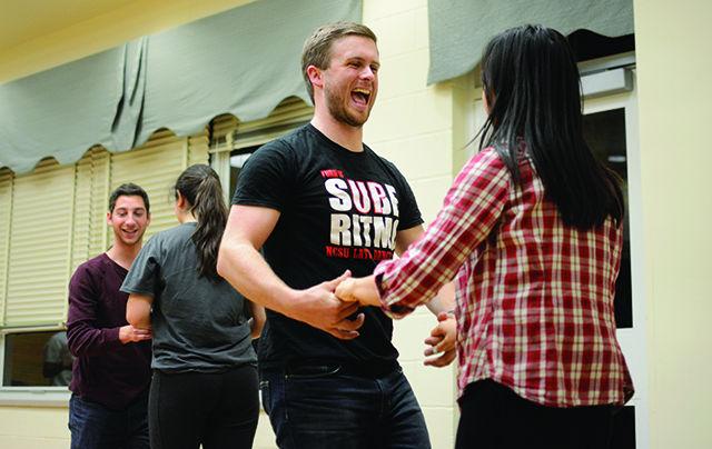 Colin Greatwood, a senior studying mechanical engineering and Phian Tran, a junior studying agricultural business management, prepare themselves for a quick latin swirl at the Sube Ritmo Latin dance workshop. The workshop was held in the multipurpose room in the Honors Village Commons on Nov. 16 from 8&#8211;9 p.m. Sube Ritmo is a Latin Dance team at NC State, and they specialize in educating the community about the different kinds of dance forms present in Latin America. They have an upcoming show on Dec. 6 in&#160;Washington Sankofa room at Witherspoon Student Center.&#160;