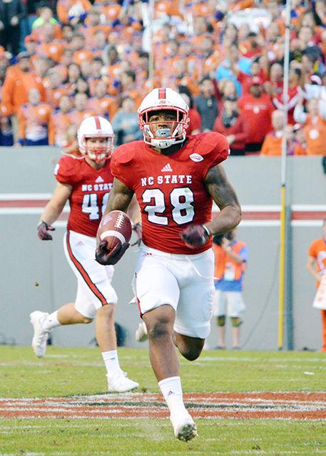 Jaylen Samuels, a sophomore tightend, rushes the ball during the homecoming game on Saturday, October 31, 2015. Samuels scored 2 touchdowns during the game. NC State lost to Clemson, with a final score of 56-41.