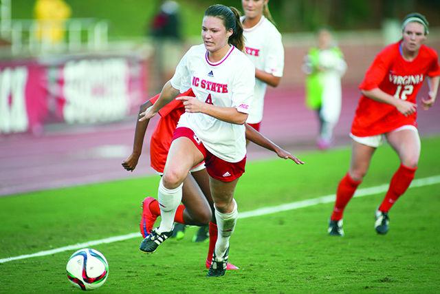 Freshman defender Hannah Keogh takes the ball away from No. 1 Virginia's attack. Keogh played the full 90 minutes and severely limited Virginia's abilties though the Wolfpack still fell 7-1 on October 28th in Dail Soccer Stadium.
