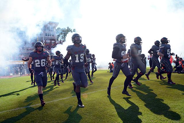The wolfpack football team rushes the field at the game vs Syracuse on Saturday November 22nd. The wolfpack won 42-29 against Syracuse.