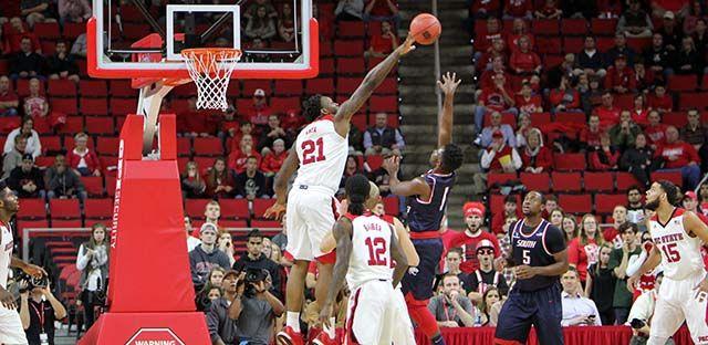 Beejay Anya, junior forward blocks a shot during the men's basketball game at PNC Arena. The wolfpack played the University of South Alabama Sunday, November 15. Anya had 8 points and 5 blocks in 25 minutes of playing time. The Wolfpack won the game 88-70.