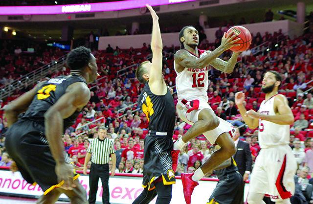Junior guard Anthony 'Cat' Barber drives past a Winthrop defender at PNC Arena on November 28. Barber's 37 points and 39 minutes playing time led the wolfpack in scoring and minutes played. The Wolfpack won the game 87-79.
