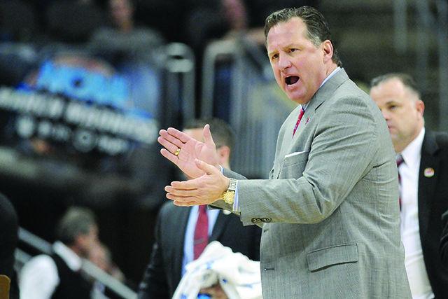 Head coach Mark Gottfried claps his hands during a timeout in the 2nd round game of the NCAA Tournament against LSU Thursday, March 19, 2015. Gottfried's Wolfpack defeated the Tigers 66-65 off of a last second shot by sophomore forward BeeJay Anya at CONSOL Engergy Center in Pittsburgh, PA.