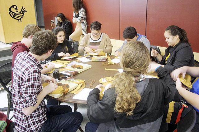 Students make moccasins at the Rock Your Mocs event at Witherspoon Hall Nov.9.&#160; This event was one of many Native American Heritage Month activities on campus. After building the moccasins, students are encouraged to wear them all week. The event was co-sponsored by Cisco.