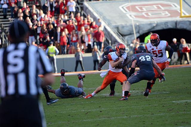 Pratt Germaine, a sophomore safety attempts a tackle against Syracuse opponent. The wolfpack won 42-29 against Syracuse.