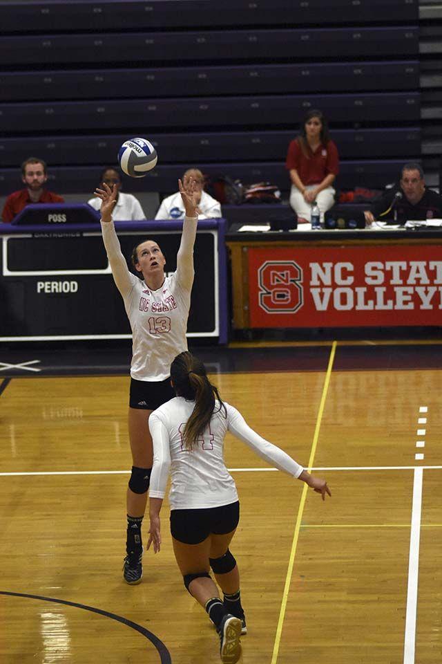 Junior setter Maggie Speaks sets up freshman middle blocker Blayke Hranicka for a spike against Wake Forest. Speaks led the Woflpack on October 2nd at Broughton High School with 50 assists while Hranicka led with 17 kills. The Wolfpack won 3-1 against Wake Forest in front of a crowd of nearly 900.